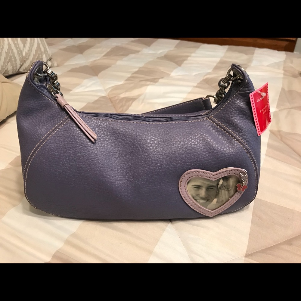 Brand new, small purple leather purse
